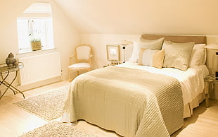 white bed room during daytime